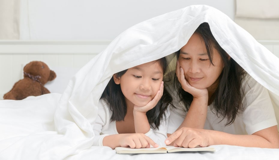 girl with mother reading