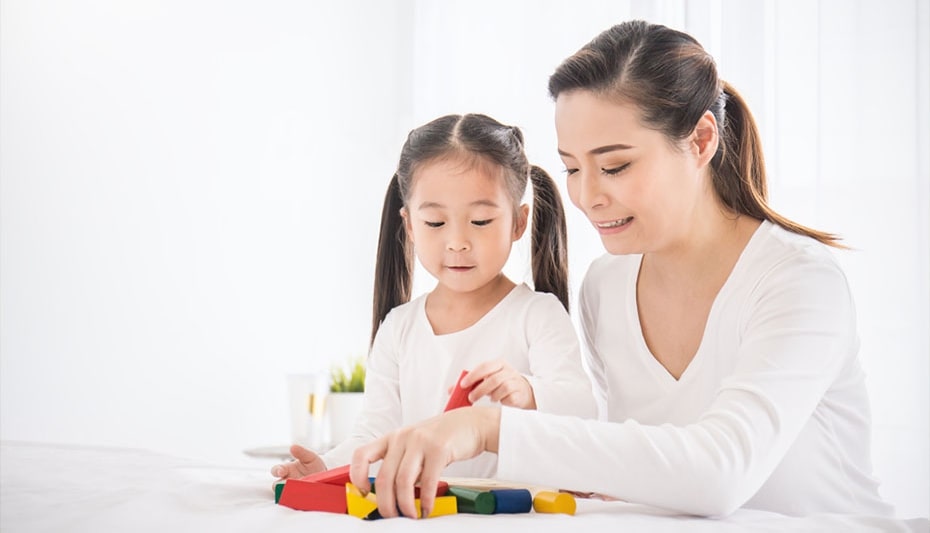 girl and mother playing