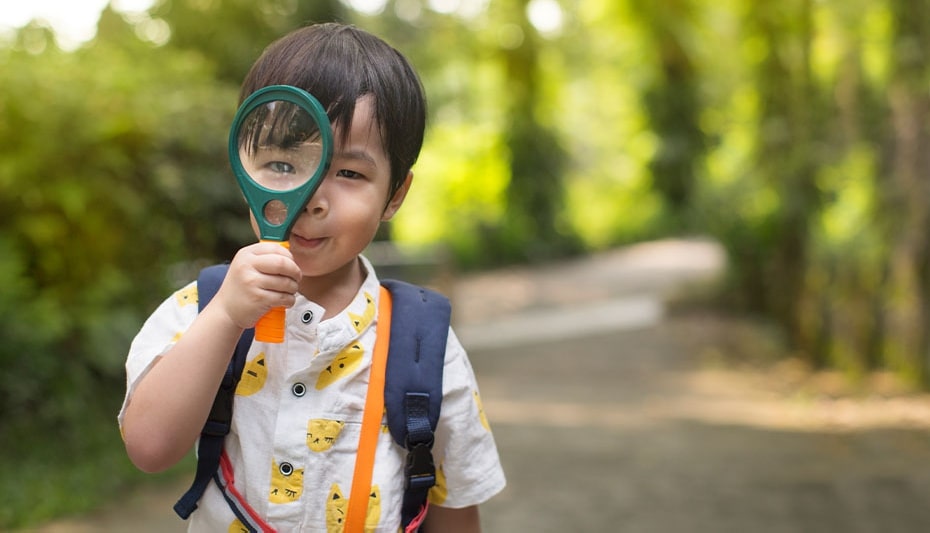 boy with magnifier