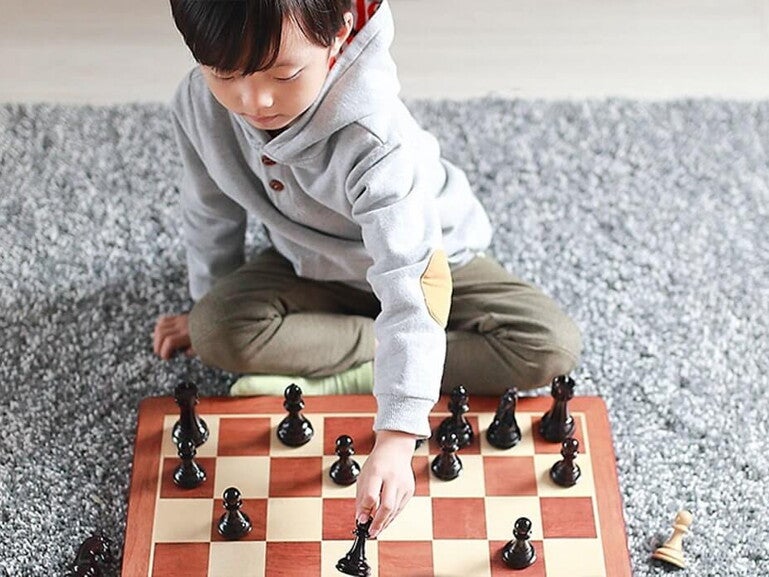 boy playing chess